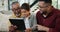 Father, son and old man with tablet on sofa in living room of home together for visit. Family, technology or social