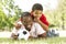 Father And Son In Park With Soccer Ball