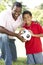 Father And Son In Park With Soccer Ball