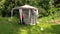 Father and son people attach protective tent bower net in garden