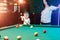 Father and son play billiards. The father teaches his son to play billiards. The concept of parents and children, upbringing,