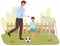 Father with son play football on field. Men running after ball. Family is resting actively