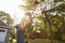 Father And Son Playing Basketball On Driveway At Home