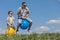 Father and son playing on the field at the day time.