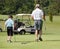 Father and Son Playing Golf