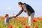 Father and son in poppy field