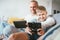 Father and son portrait with electronic devices playing. Sitting