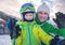 Father with son portrait on ski snow resort