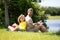 Father and son reading book in park, man encourages boy to knowledge, family education. Father and child read book