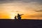 Father and son at the red desert at dawn. Traveling with children concept