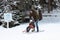 Father and son riding a sledge in motion