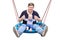 Father with son sitting on big modern chain swing and laughing. Parent with baby boy enjoying swinging on seesaw at playground. Ha