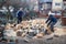 Father and son splitting wood