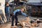 Father and son splitting wood