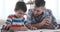 Father with son studying at home