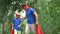 Father and son in superhero costumes high-five, teamwork concept, goal achieving