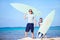 Father and son with surfboards