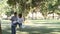 Father and a son swinging in a park