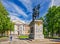 Father and son taking photos around the monument to The Peter The First in front of Mikhaylovsky Castle.