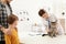 Father and son with their pet visiting veterinarian. Doc examining cat