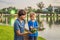 Father and son tourists celebrates Loy Krathong, Runs on the water. Loy Krathong festival, People buy flowers and candle