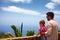 Father and son, tourists enjoying the fascinating view on Atlantic ocean coastline from observation deck