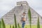 Father and son tourists observing the old pyramid and temple of the castle of the Mayan architecture known as Chichen