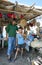 A father and son with various goods for sale at their roadside stall near Fez, Morocco.