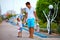 Father and son walking colorful street, shopping