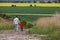 Father and son, walking in a field