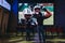 Father and son watching a game in NFL Experience in Times Square, New York, USA.