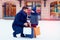 Father and son on winter shopping in city, holiday season, buying presents