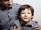 Father with son in wooden bowties same shirt