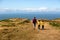 Father and sons, hiking in a beautiful nature of North Devon on a sunny day