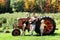 Father and Sons Playing Guitar by Old Farm Tractor