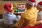 Father and sons in santa hats making laptop christmas video call with smiling santa claus