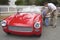 Father and sons treated the little red vintage convertible