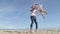 Father Spinning Daughter Round on the Beach