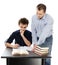 Father standing near son\'s desk helping him doing his homework