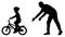 Father teaches baby to ride bicycle silhouette. First bike ride vector. Teaching a child to ride bike without stabilisers