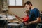 Father teaching baby boy to play drums. Parent with toddler child having fun and spending time together. Dad with kid playing