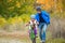 Father teaching child to ride bike