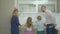 Father teaching siblings to prepare omelet in kitchen