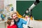 Father teaching son. Happy pupil at lesson with Astronomy telescope.