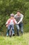 Father Teaching Son To Ride Bike In Countryside