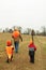 Father teaching sons how to hunt deer safely