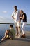 Father and teenage children on dock by water