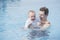 Father and Toddler Boy in Pool at a Resort in Mexico