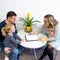 Father and toddler daughter in therapist office during counselling meeting.