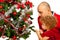 Father and toddler girl decorate tree